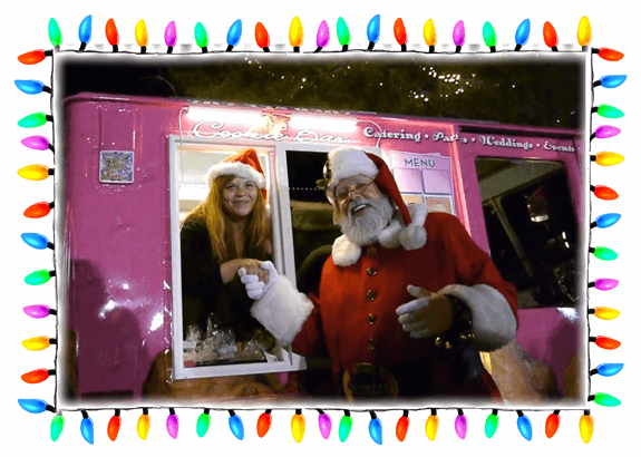 Santa claus in a pink santa claus truck.